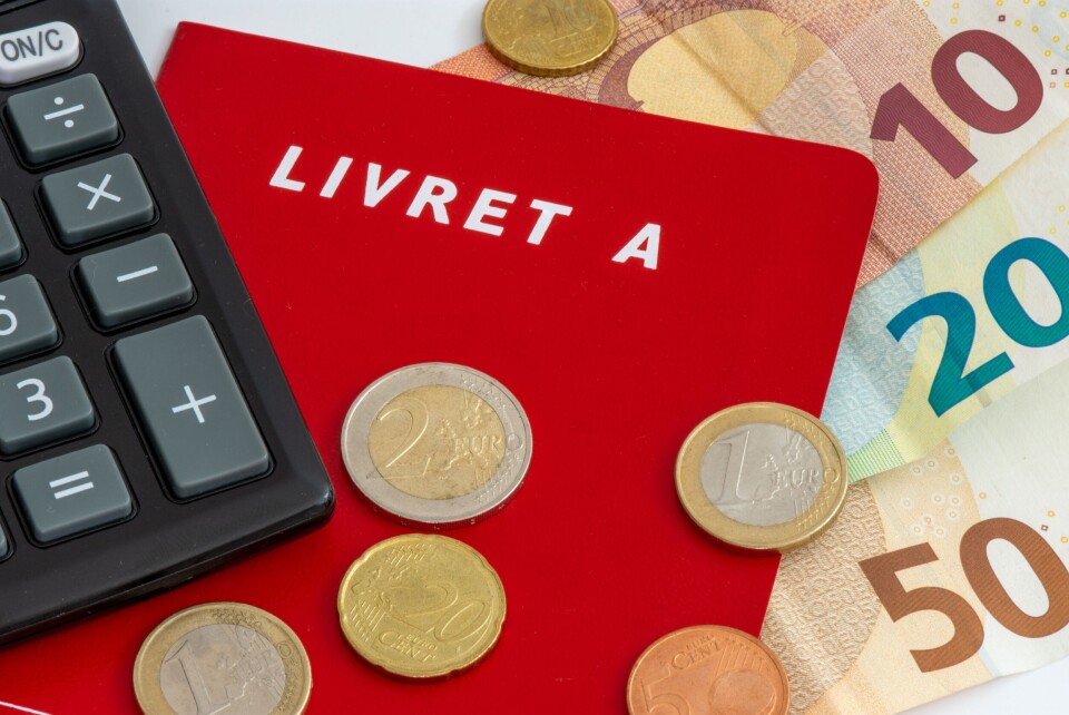 HJBC / Shutterstock A photo of a Livret A red book surrounded by coins, euro notes and a calculator