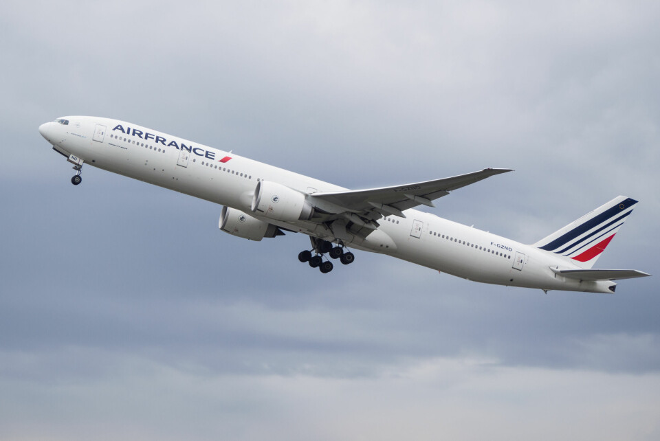 An Air France plane taking off with the landing gear visible