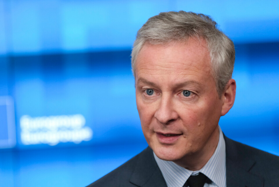 Finance minister Bruno Le Maire on a blue background