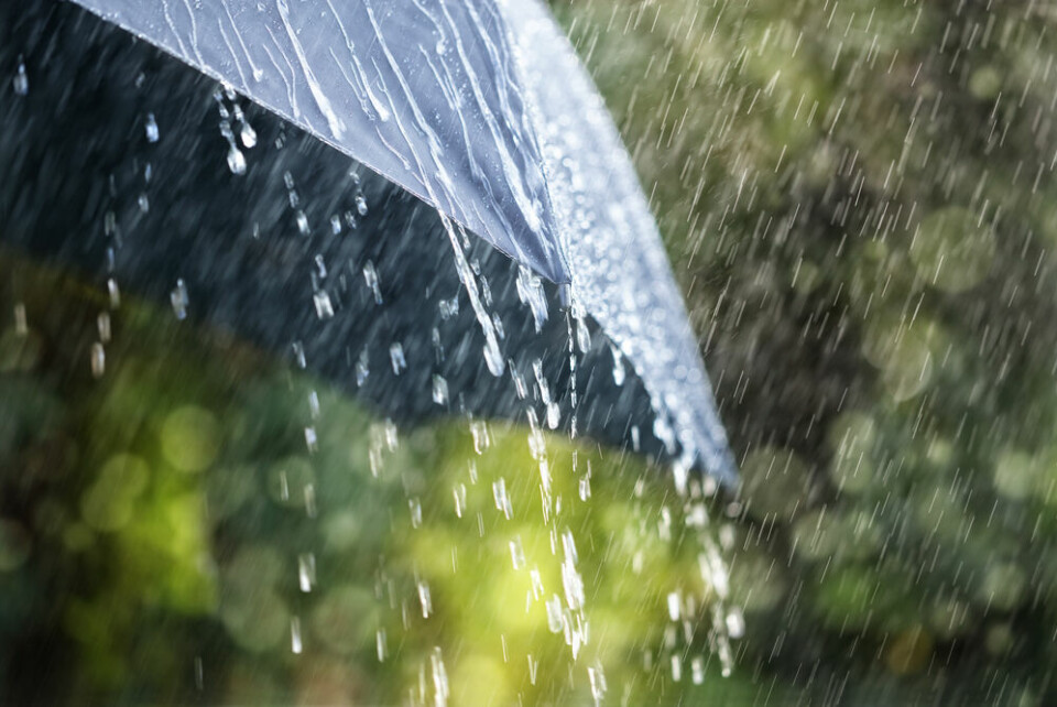 An umbrella in heavy rainfall