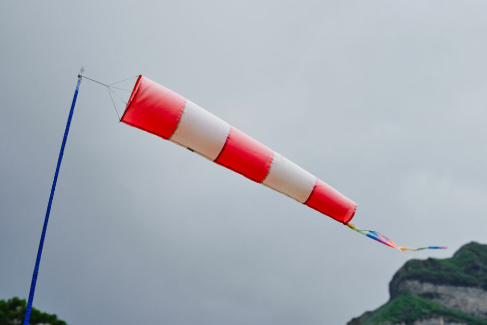 A photo of a wind sock against a stormy, grey sky