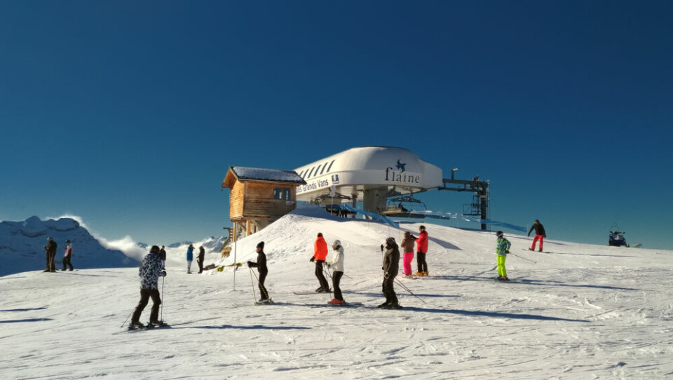 Skiers on a mountain top, in the Grand Massif ski domaine, in Flaine, France