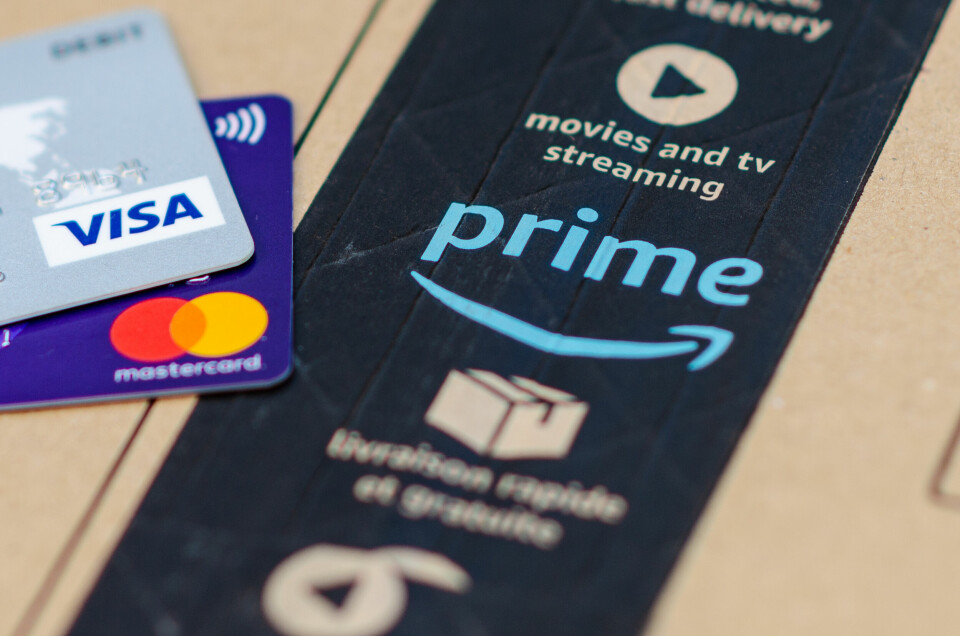 Close up photo of Amazon Prime parcel with a large Amazon Prime logo, VISA and Mastercard credit cards