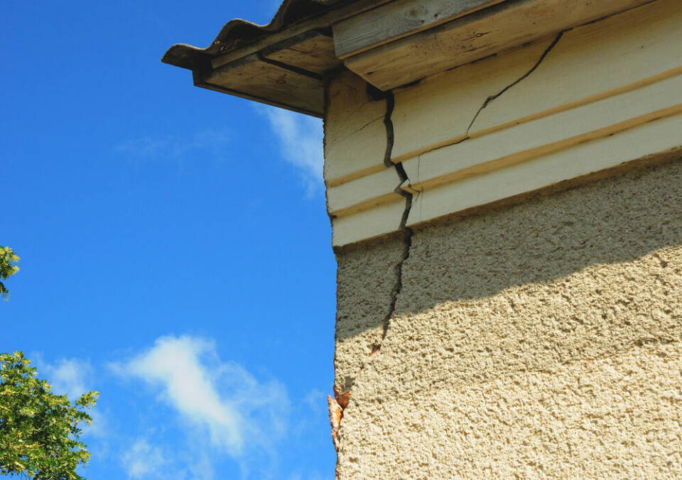A view of a serious crack in the outside of a house