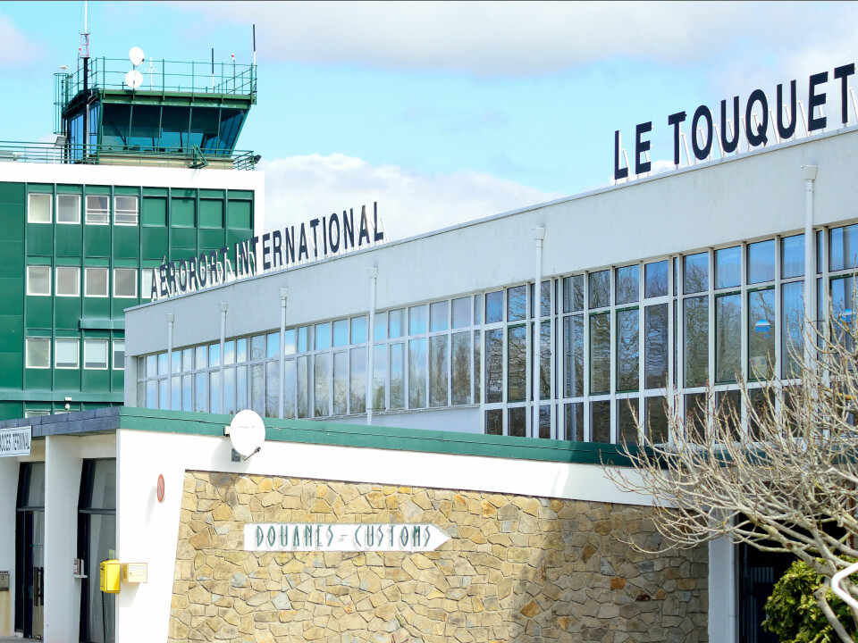 A photo of the terminal and control tower at Le Touquet Airport, France