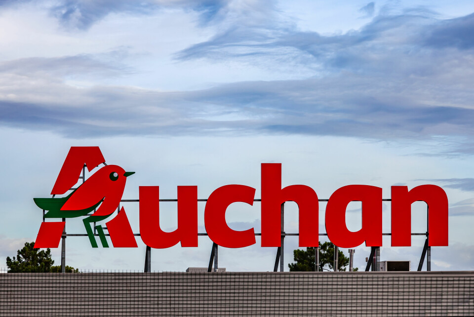 Auchan logo on the top of a building