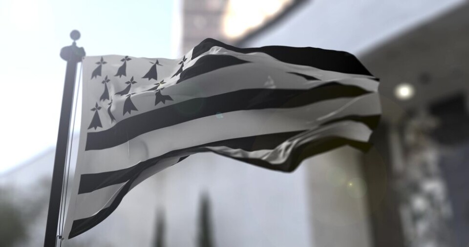 Postmodern Studio / Shutterstock A Breton flag waving in the wind