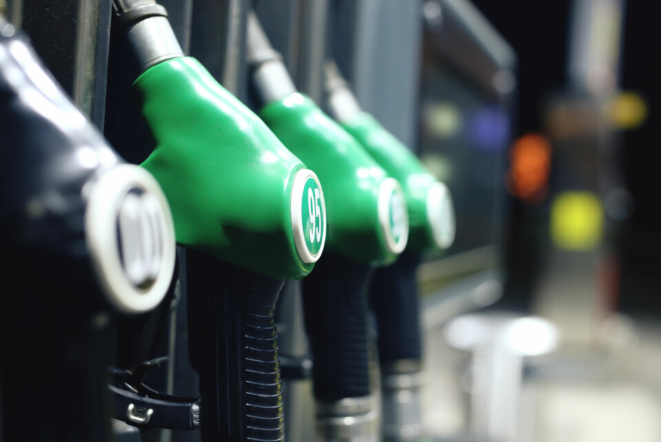 A photo of a petrol station with a close-up of pumps