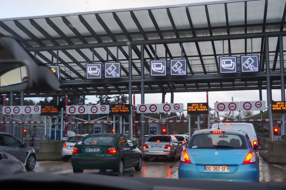 Spech / Shutterstock Cars queuing to go through motorway toll