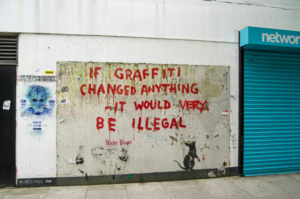 A view of a Banksy graffiti piece in London, UK