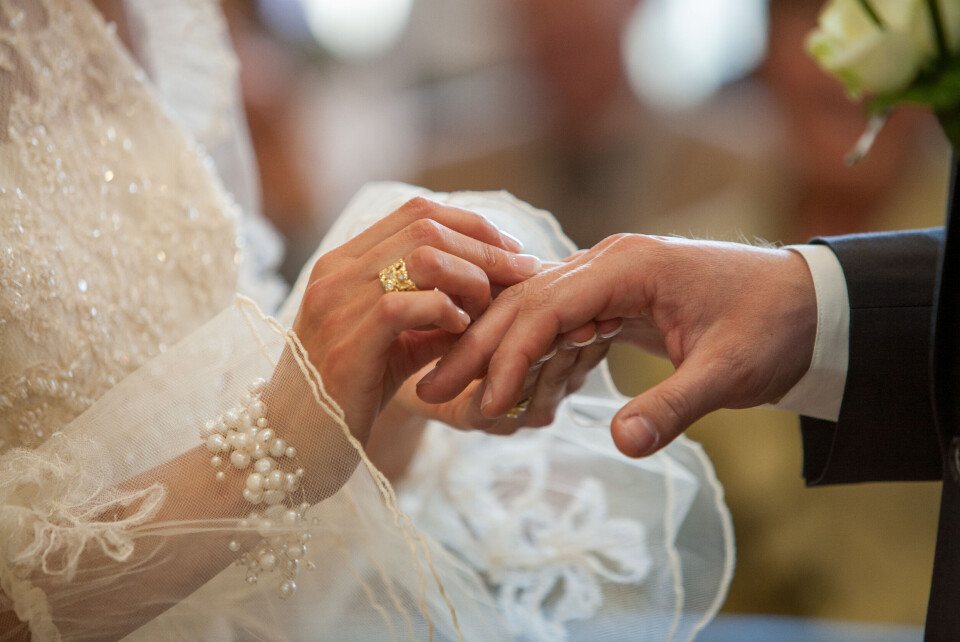 A couple exchanging rings at a wedding