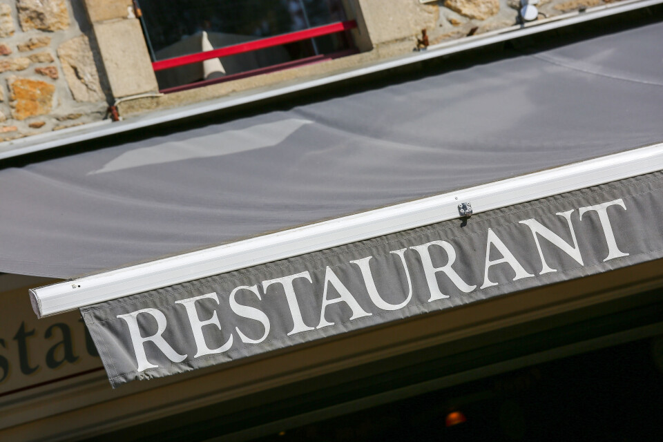 pixinoo / Shutterstock A photo of a restaurant awning in France, reading RESTAURANT