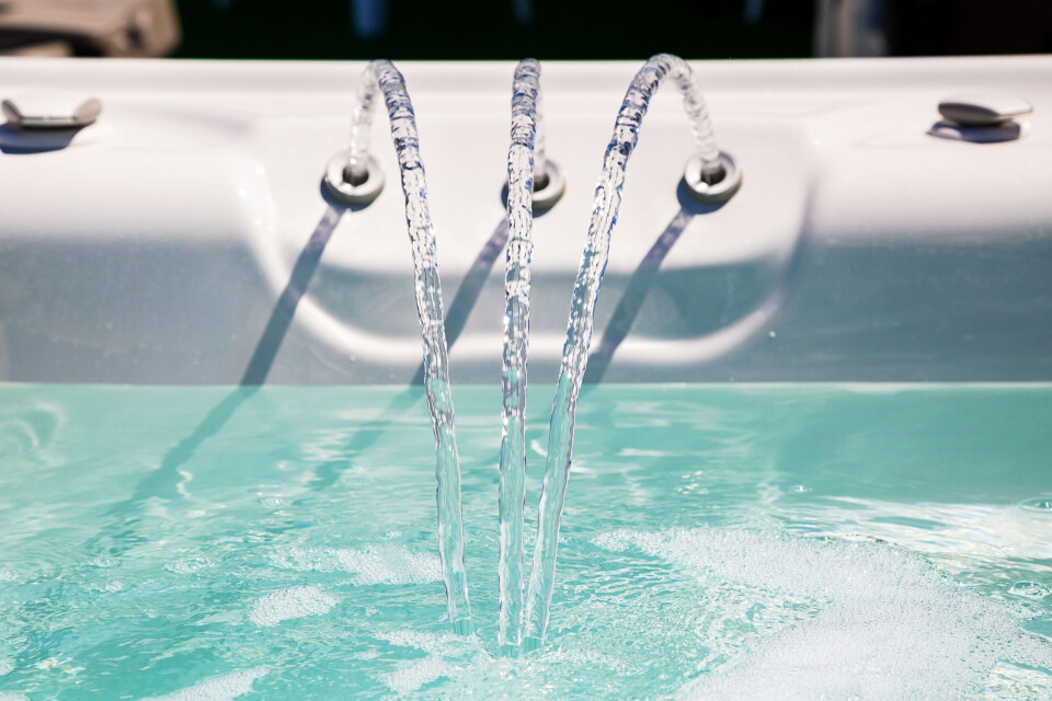 A photo of three jets filling up a jacuzzi