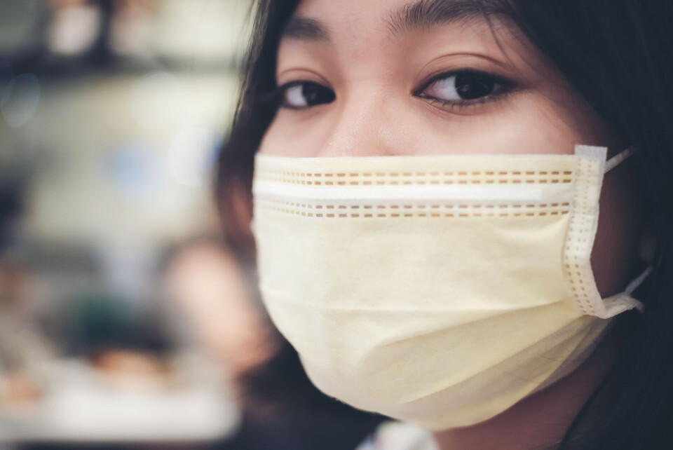 FLUKY FLUKY / Shutterstock A woman wearing a thicker FFP2 face mask outdoors
