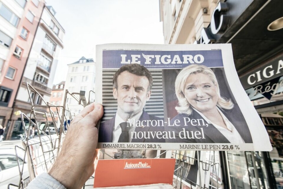 A newspaper showing Macron and Le Pen against each other again