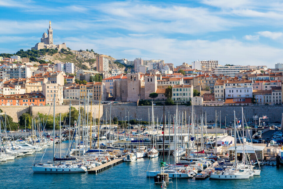 Aerial panoramic view of the Notre-Dame de la Garde basilica and the old port of Marseille, France
