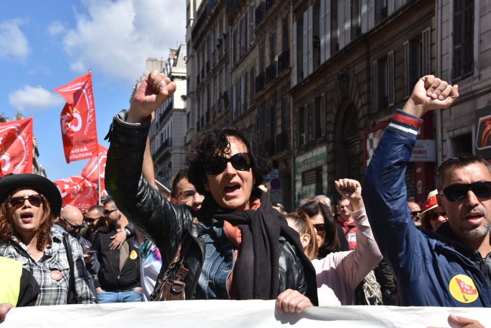 Protesters with union banners march