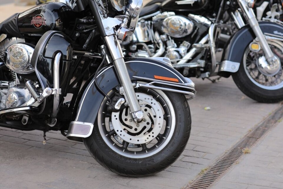 A photo of a motorbikes parked in a line