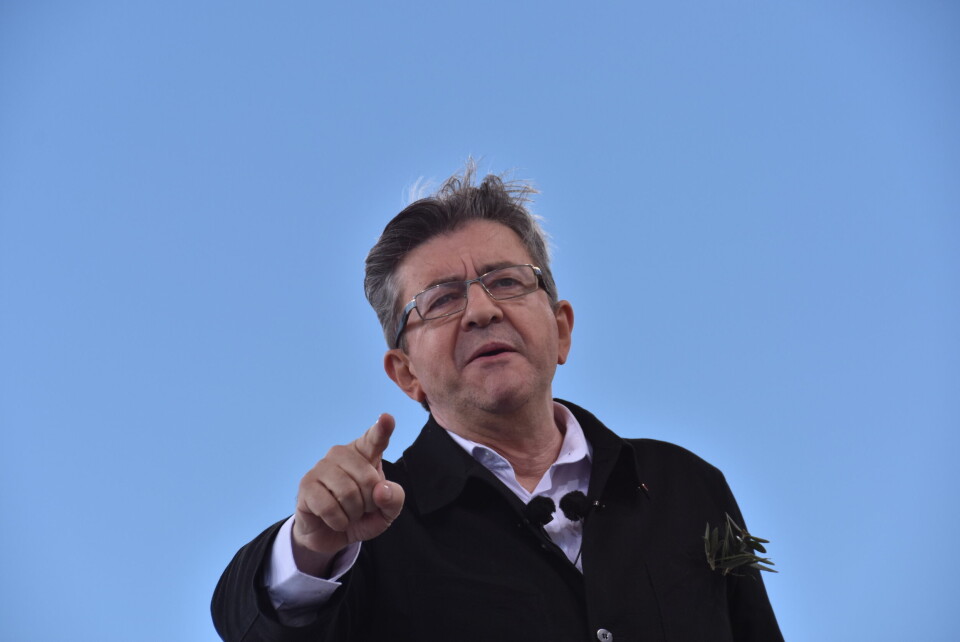 Jean-Luc Mélenchon pictured against a bright blue background