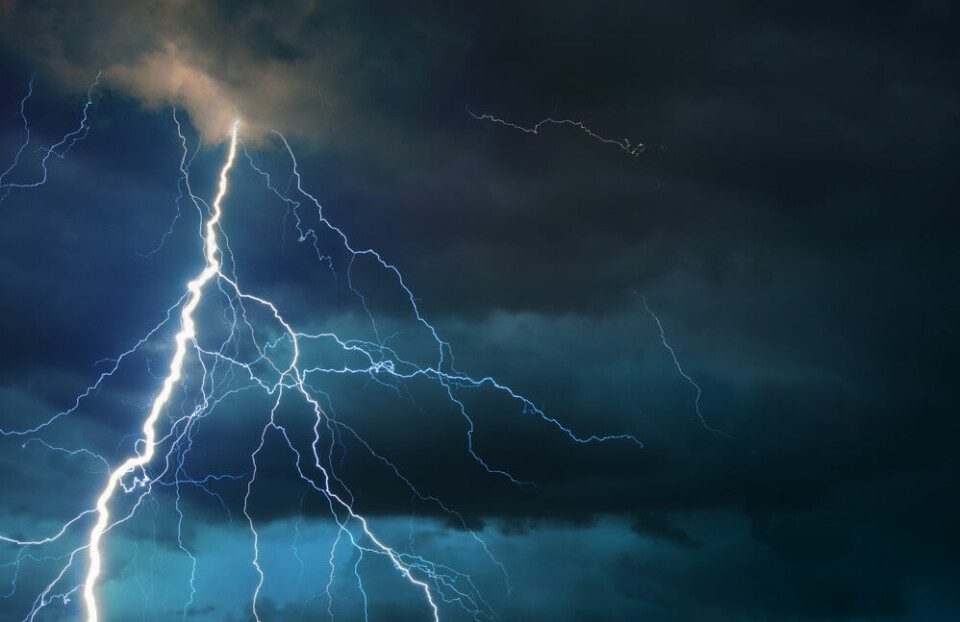 A lightning strike across a stormy sky