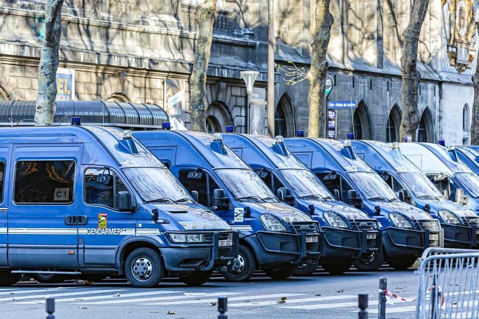 A row of blue gendarmerie vans in Paris