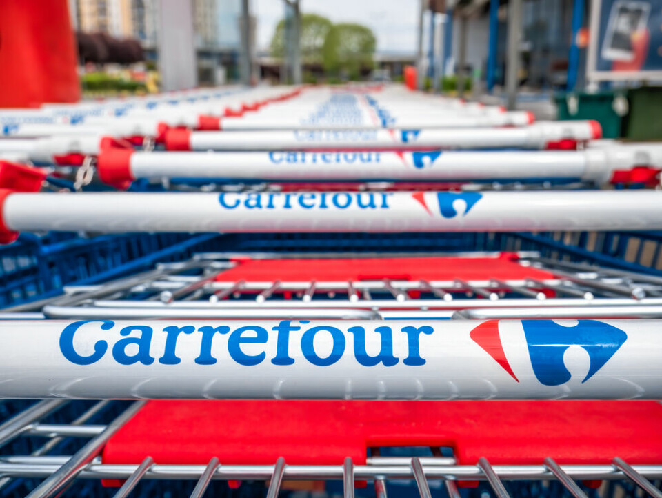 A line of Carrefour shopping trolleys