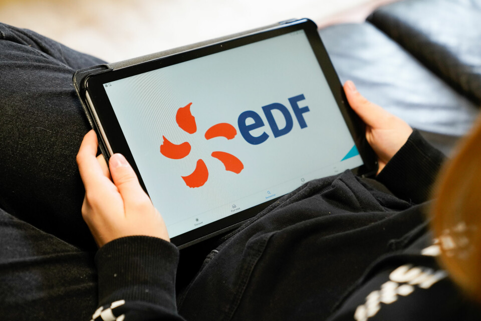 A photo of someone using a tablet with the EDF logo