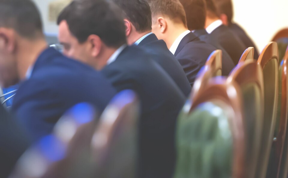 Men in suits in a meeting