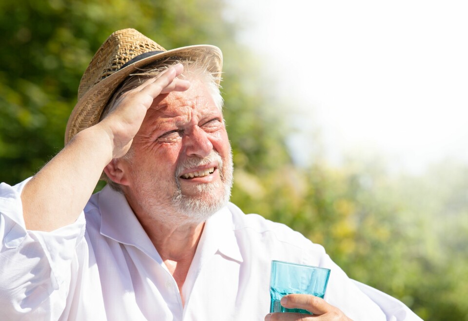 an image of a man squinting in the sun