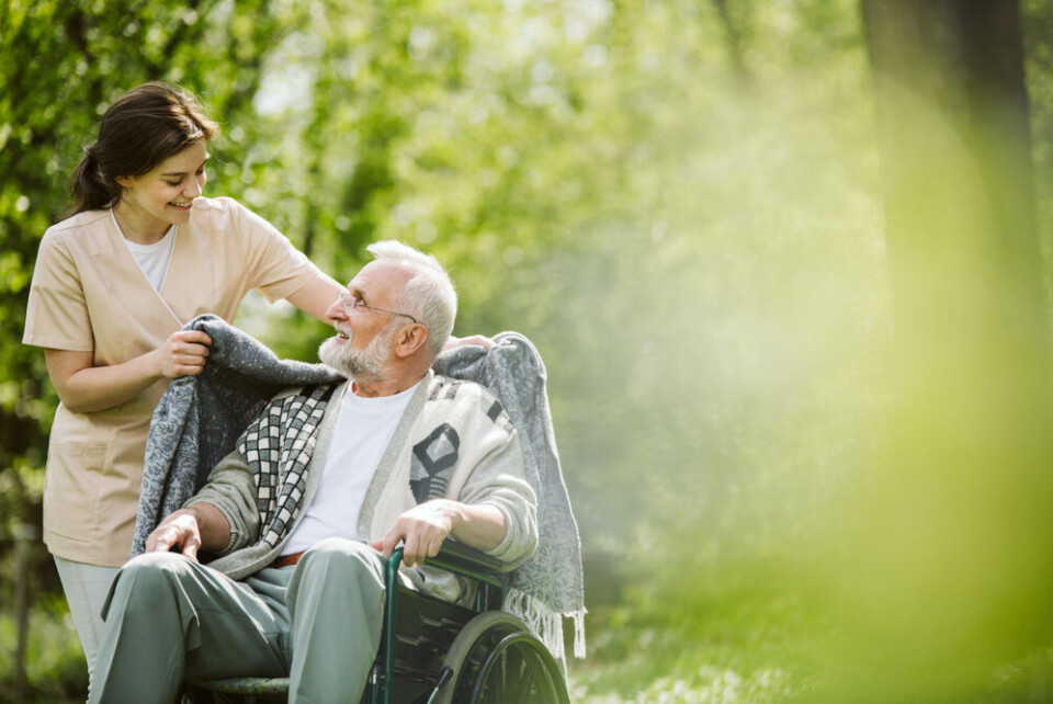 Photographee.eu / Shutterstock A carer with her patient