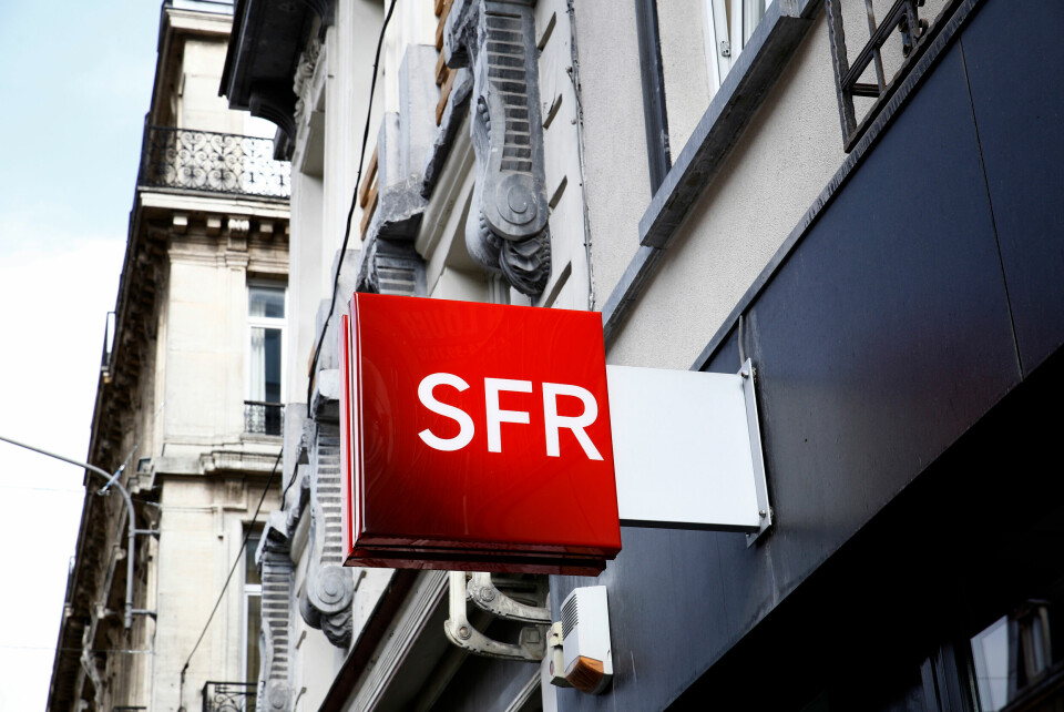 The logo of French telecoms operator SFR is seen outside one of their stores