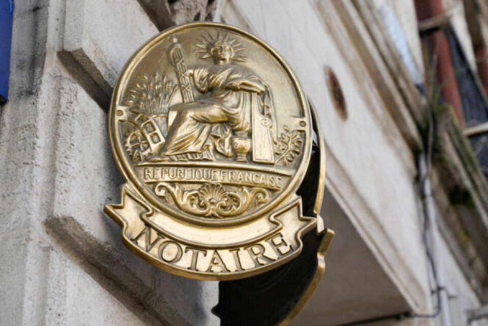 Notaire sign gold on wall notary office as part of an article on tips to reduce your inheritance tax in France