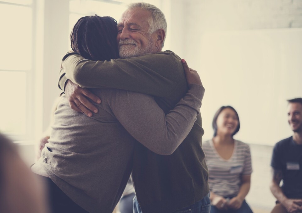 Rawpixel.com / Shutterstock An elderly person hugging someone