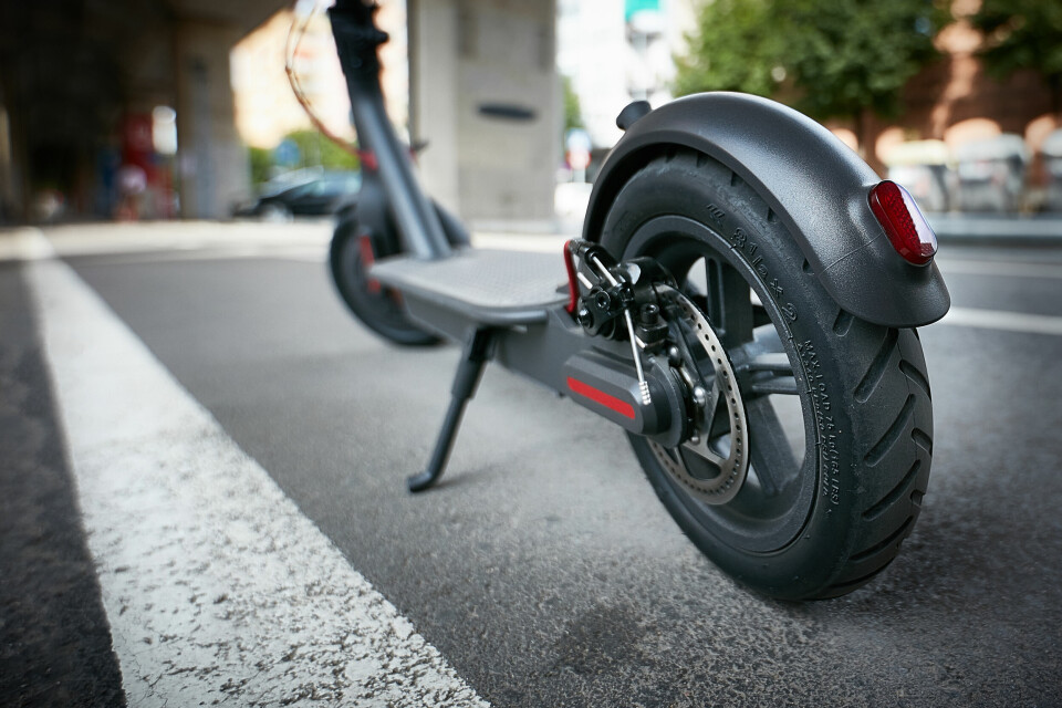 An electric scooter stopped on a road