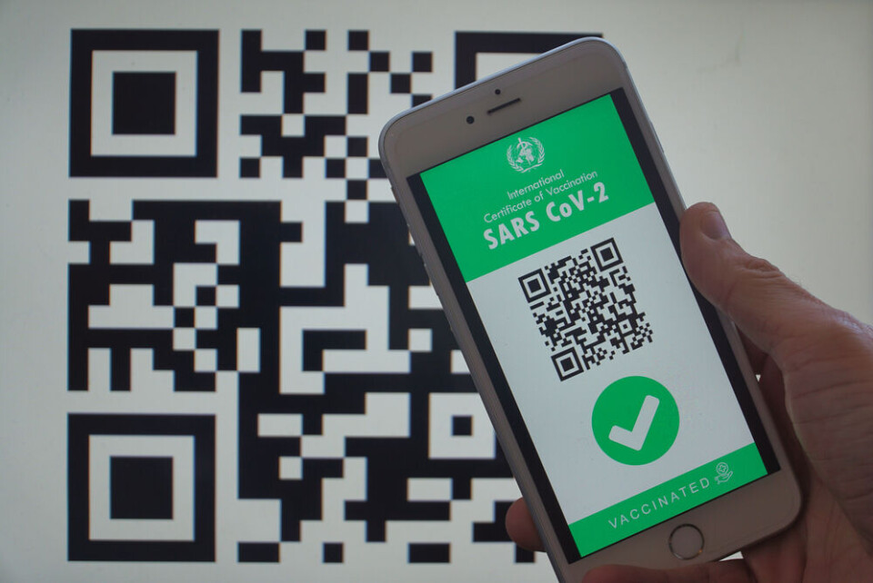 Turkfotograf / Shutterstock Smartphone displaying a digital vaccination certificate for Covid-19 in male's hand, with QR code screen in background. Paris nurse suspected of creating false Covid-19 vaccine certificates