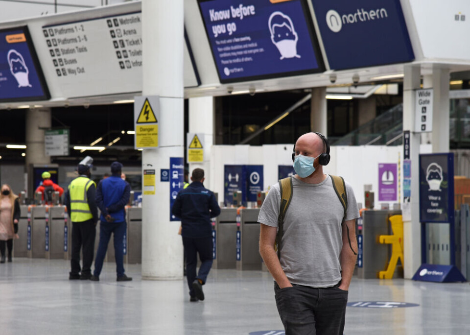 Jon Fitton / Shutterstock UK airport passenger with mask