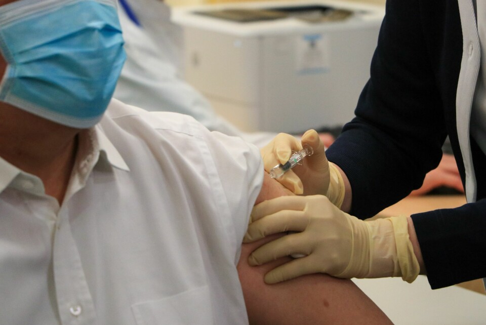 A man receiving a vaccine. France AstraZeneca Covid jab: Nine new cases of thrombosis reported