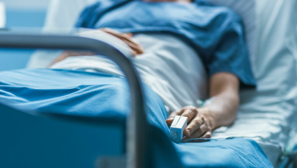 Man lying in hospital bed. Covid France: Average age of patients in intensive care is now 59