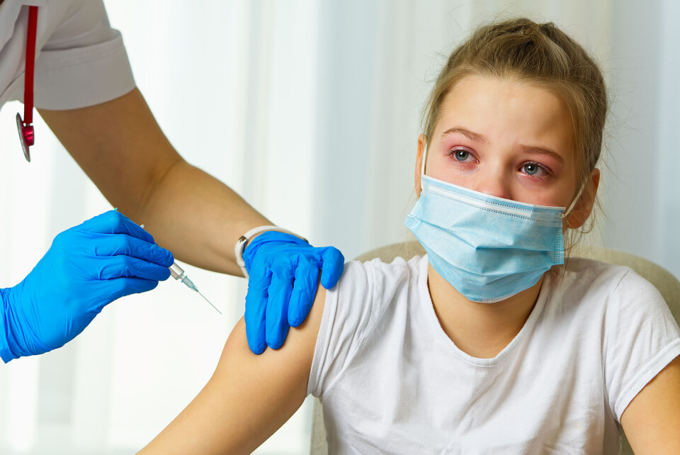 A young girl is vaccinated