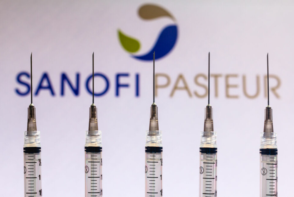 Medical syringes seen with Sanofi Pasteur company logo in background. French-made Sanofi Covid vaccine moves a step closer to use in EU