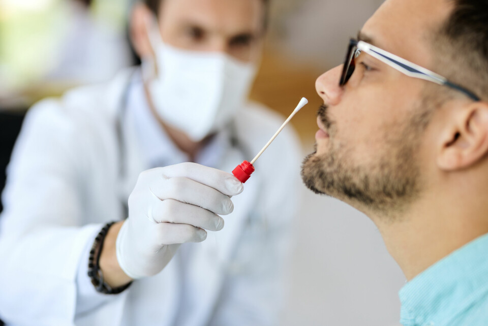 A man receiving a Covid-19 test nasal swab