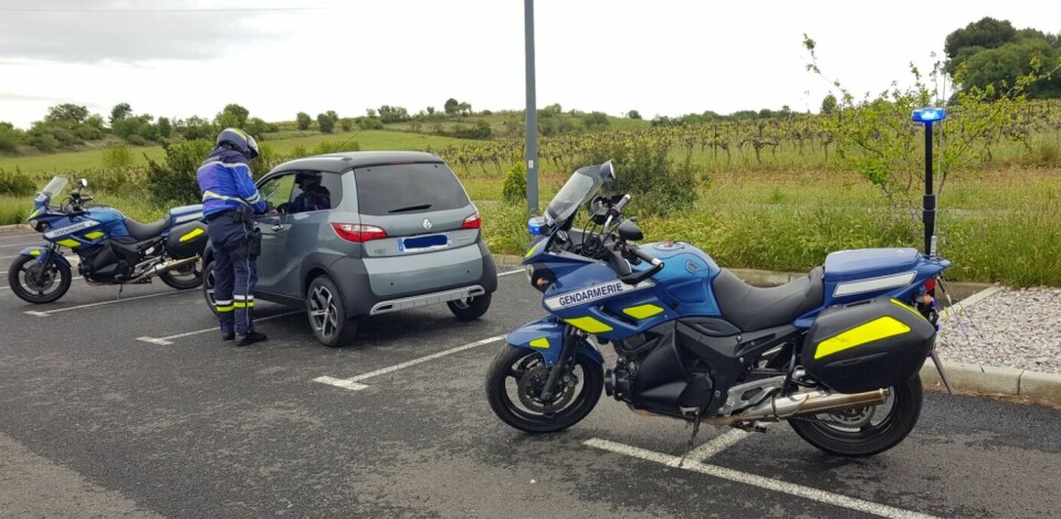 Gendarmerie stop a slow driver in electric car on motorway. Driver in south of France fined for driving too slowly on motorway