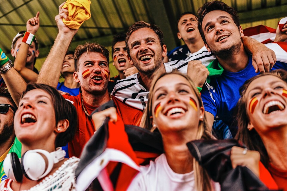 Fans from many countries in a sports stadium