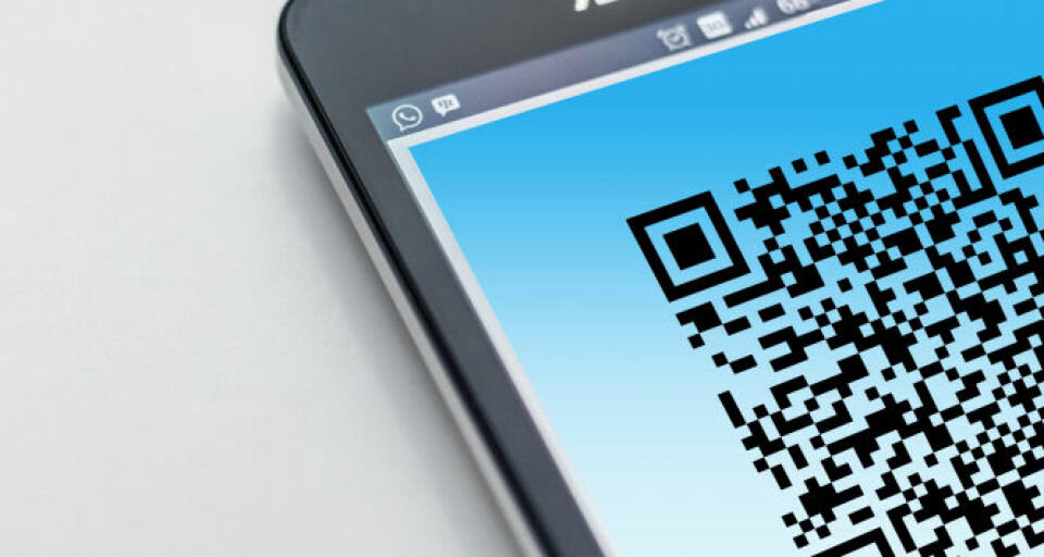 A QR code on a phone screen. Covid France: Health pass ‘should only be for vaccinated people’