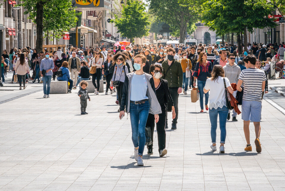 Keitma / Shutterstock People on street in Lyon, some wearing masks. Covid France: When can we stop wearing face masks?