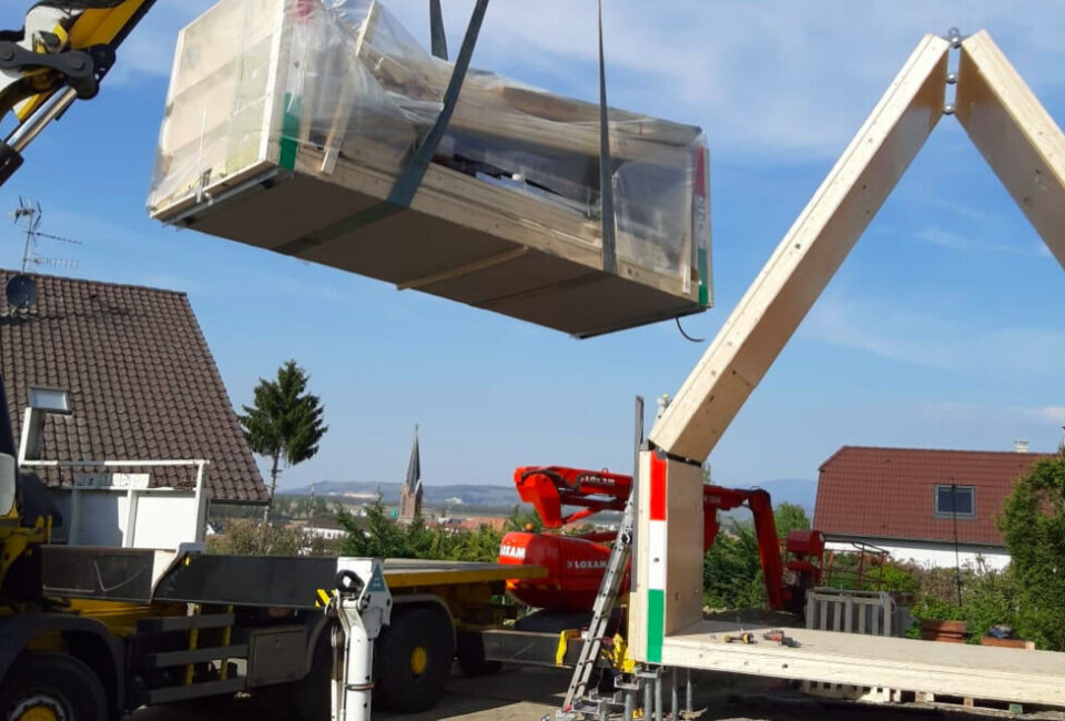 Flat-pack home being constructed. France’s first low-cost 'flat pack' wooden house under construction