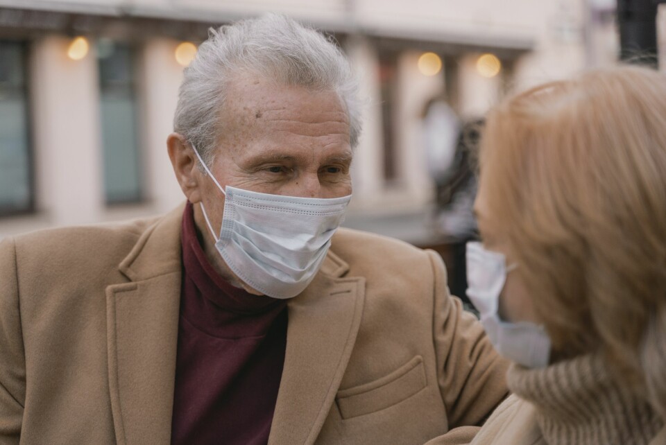 An older man wearing a mask. Covid cluster found among 11 vaccinated pensioners in French care home