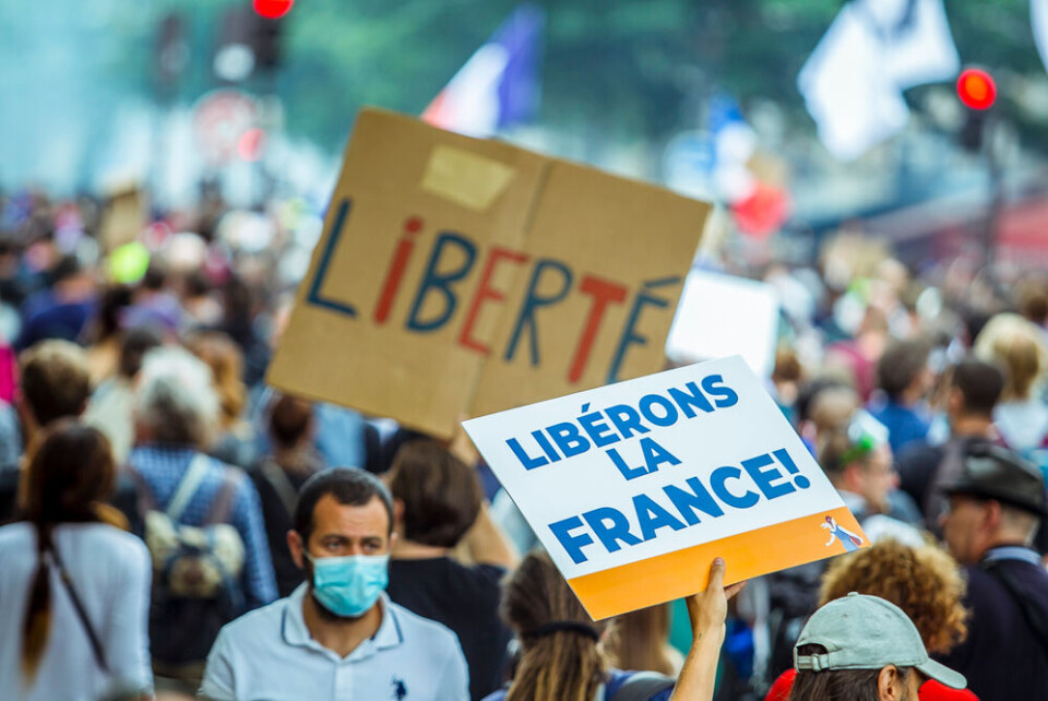 Norbu Gyanchung / Shutterstock Thousands of people protest in Paris against the Covid health pass, with placards reading Liberons la France and Liberte. 141,000 march against health pass in France on eighth protest weekend