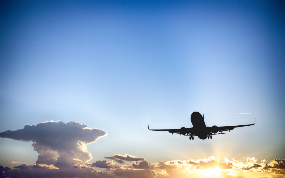 dade72 / Shutterstock An image of a plane rising through the air at sunset