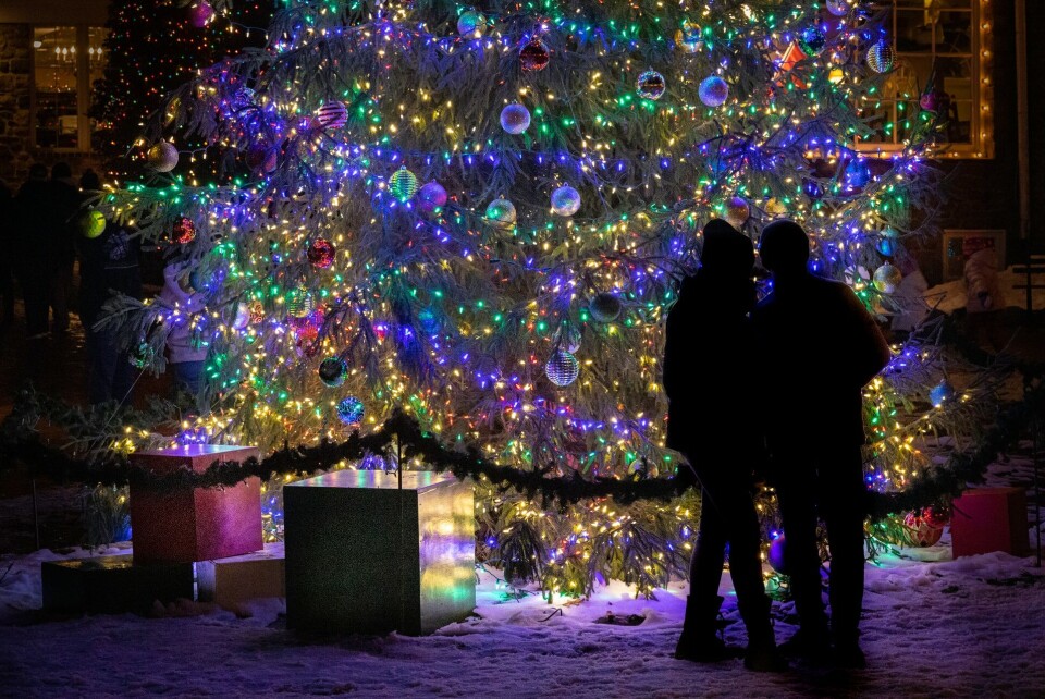 People look at outdoor Christmas decorations